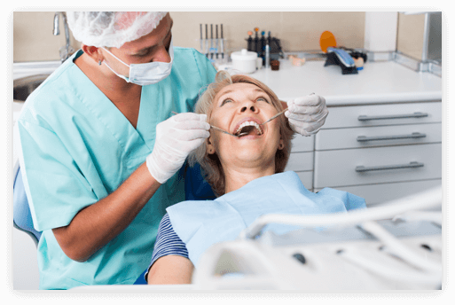 Teeth Cleaning Appointment woman in a dental chair having her dentures checked by a denturist