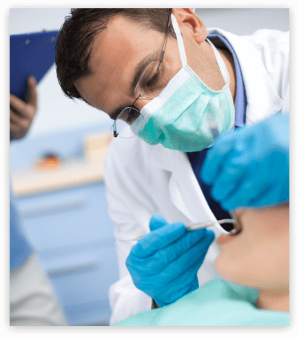 Dental Check-up denturist checking a patient's mouth