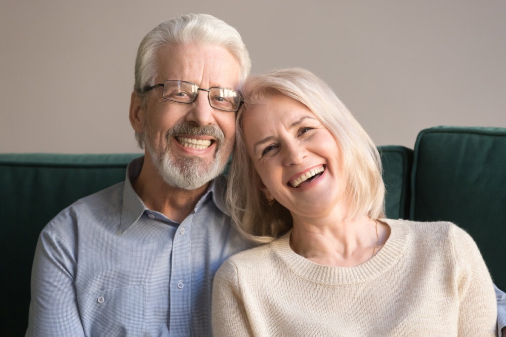 smiling couple with dentures