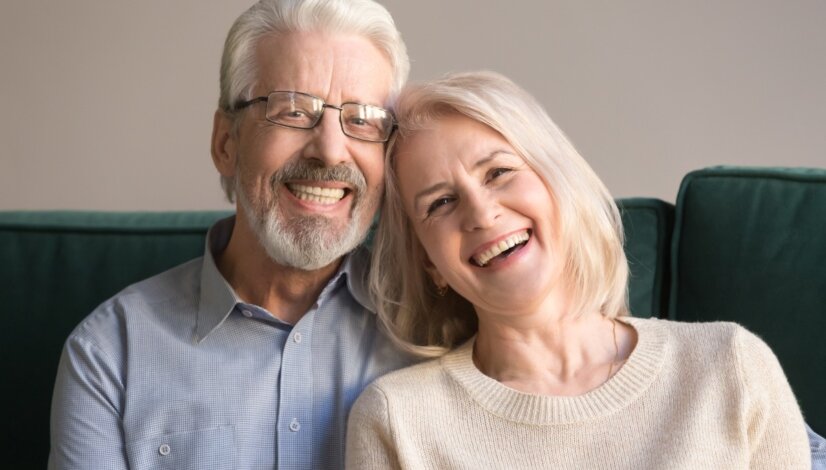smiling couple with dentures