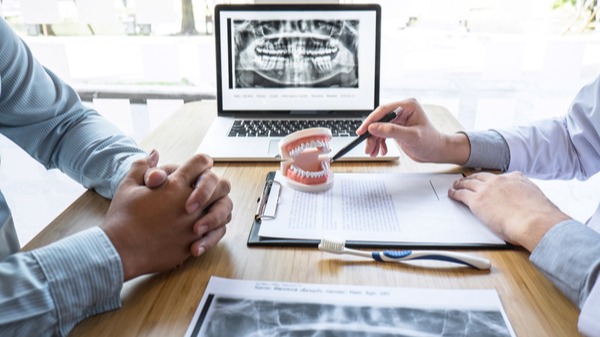 a denturist discussing the different types of dentures available