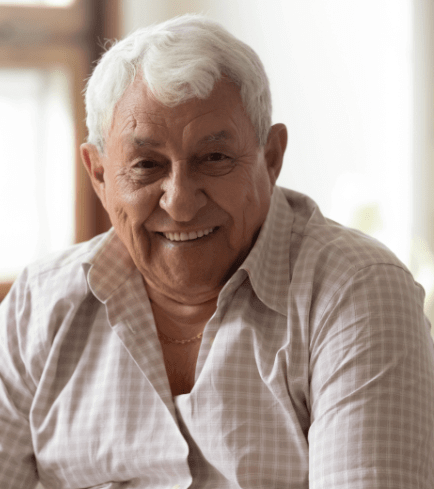 Denture soft liner happy customer Senior man with dentures smiling.