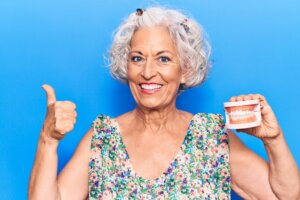 A denture patient happy with high quality dentures.