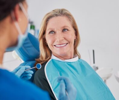 Smiling senior woman looking at dentist